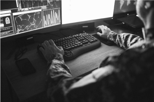 Military Soldier looking at a computer screen